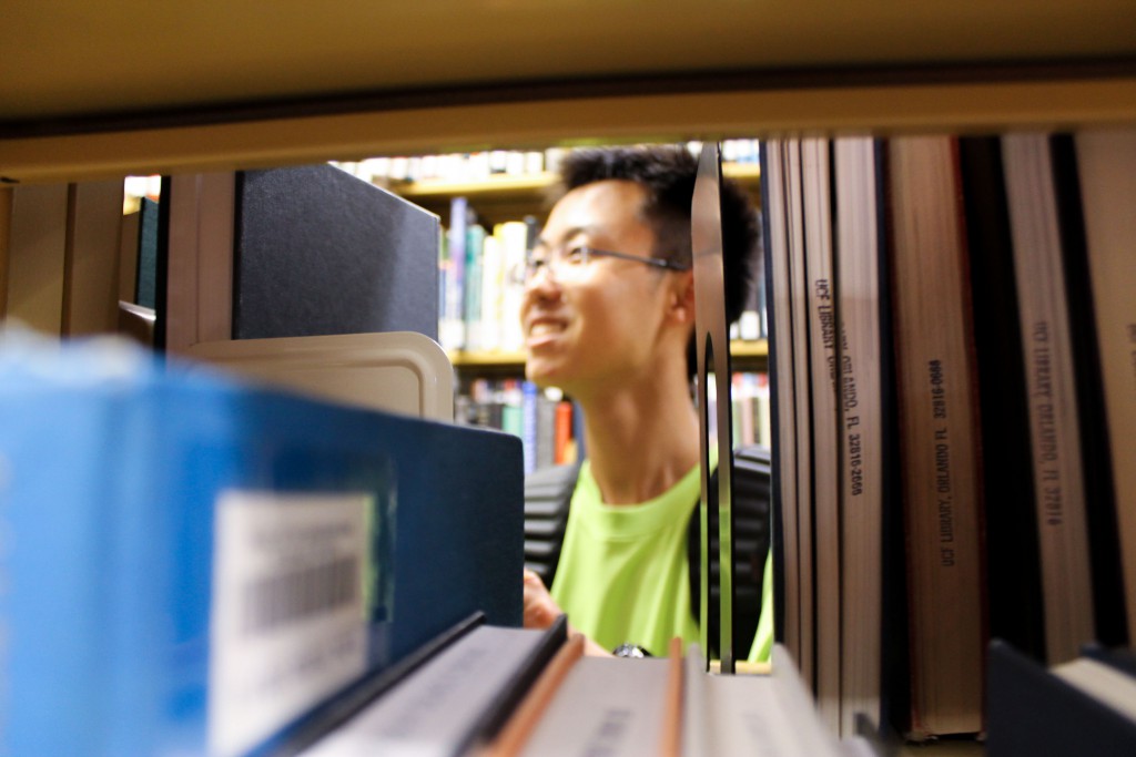 student in row of books