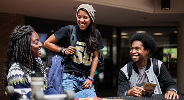 Campus Life A group of students have a conversation by the Washington Center.