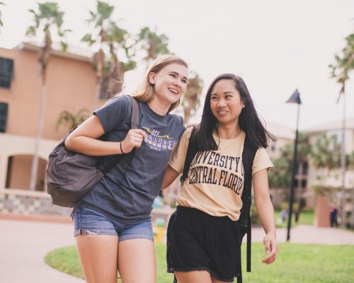 two female students walking on campus