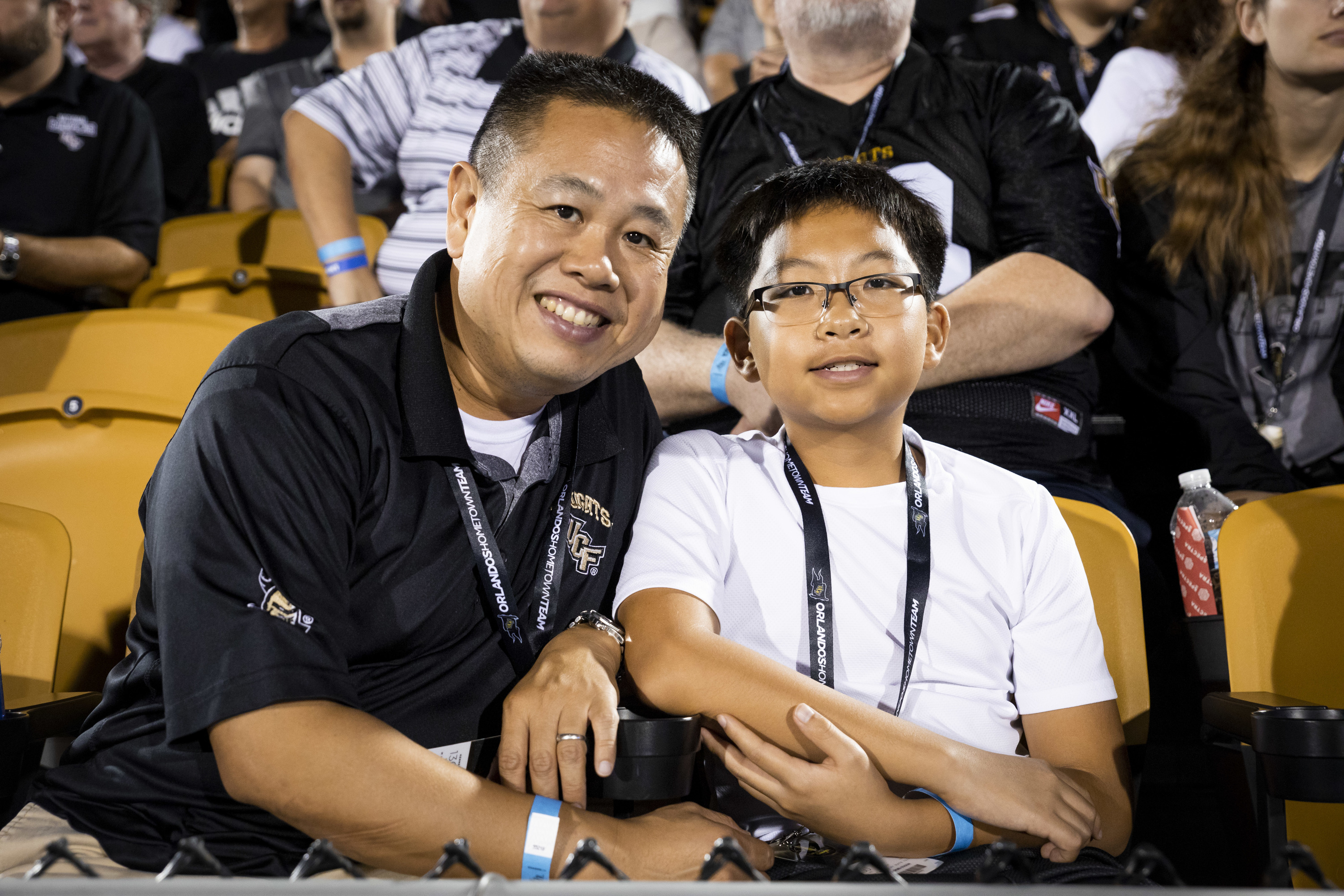 student at sporting event with child