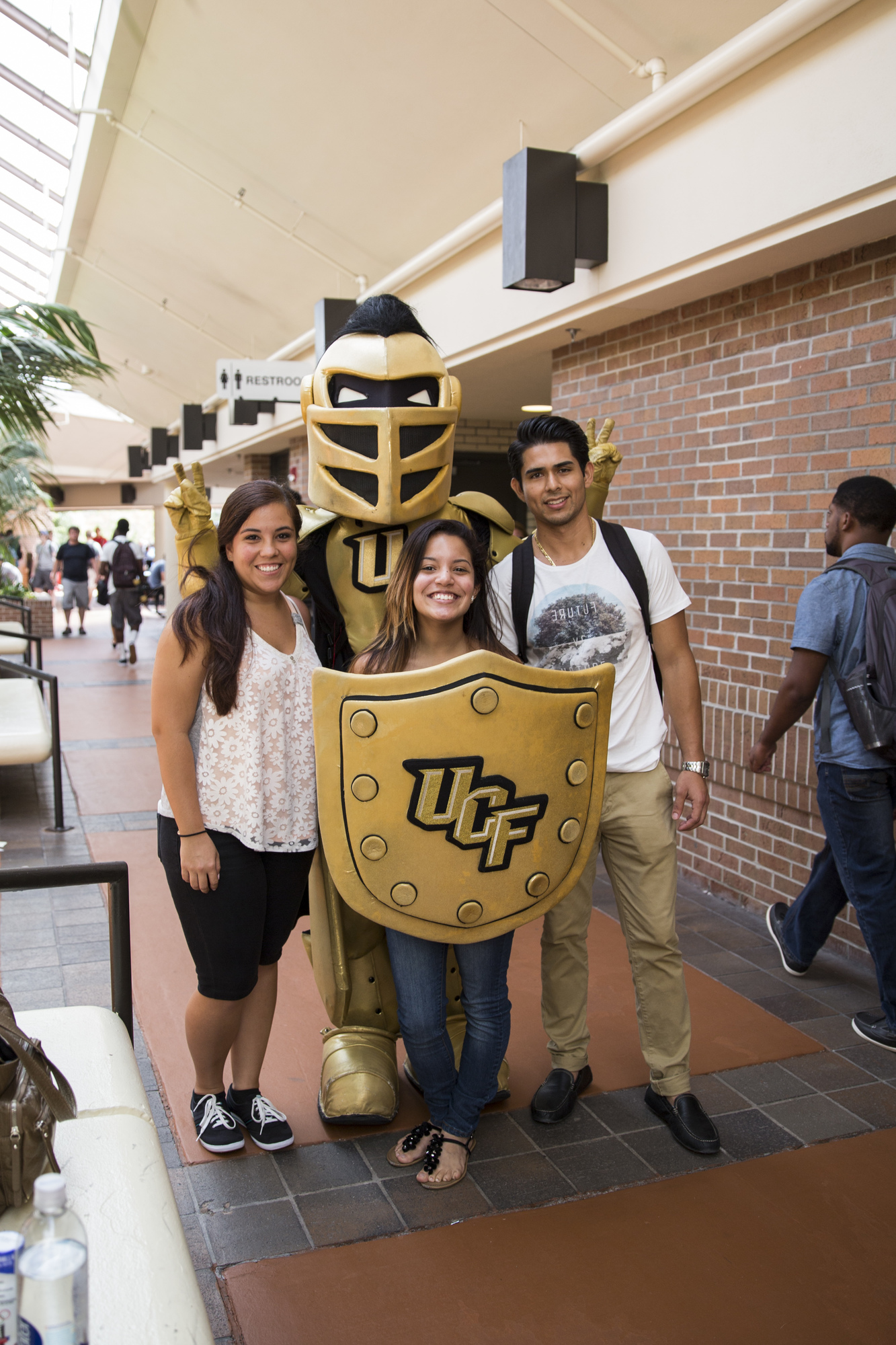 international students with mascot