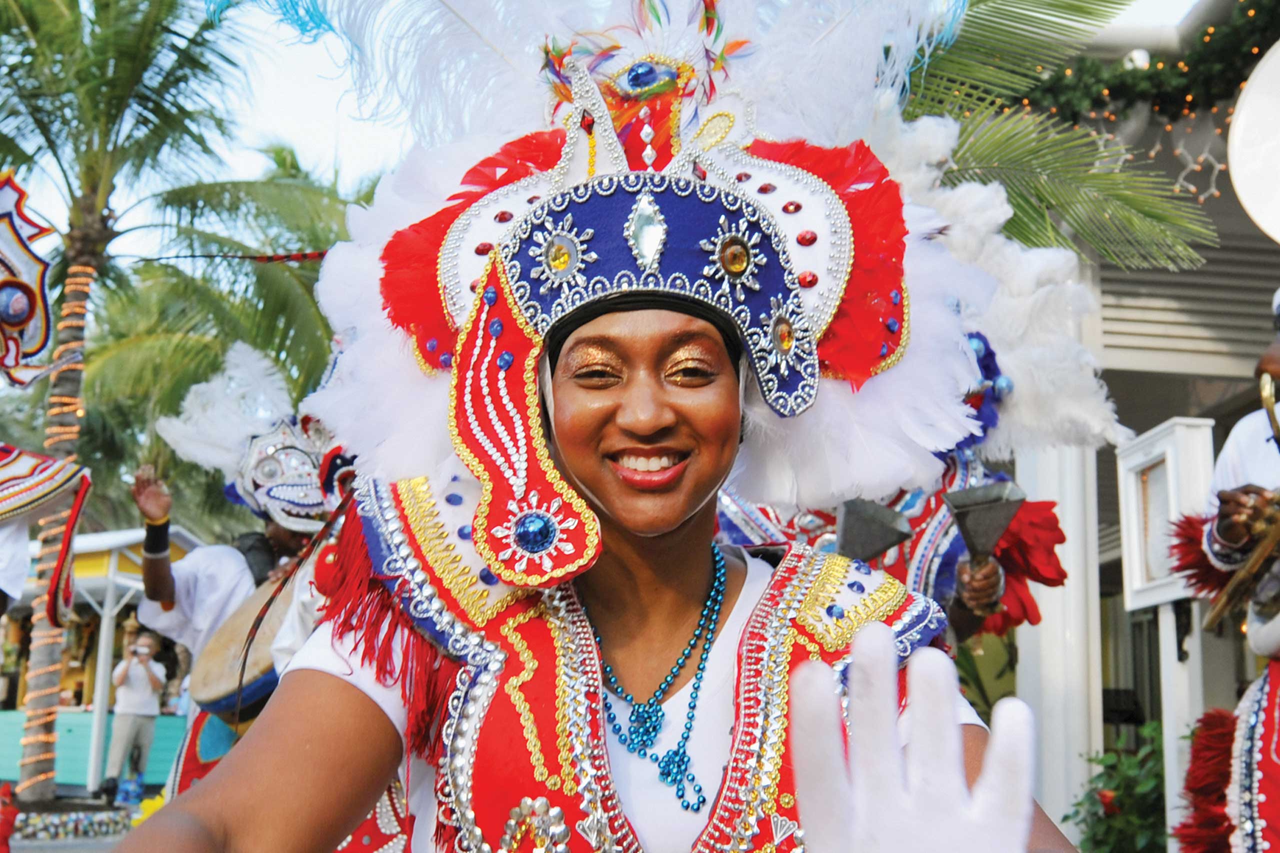 Dancer in colorful festive attire with headdress