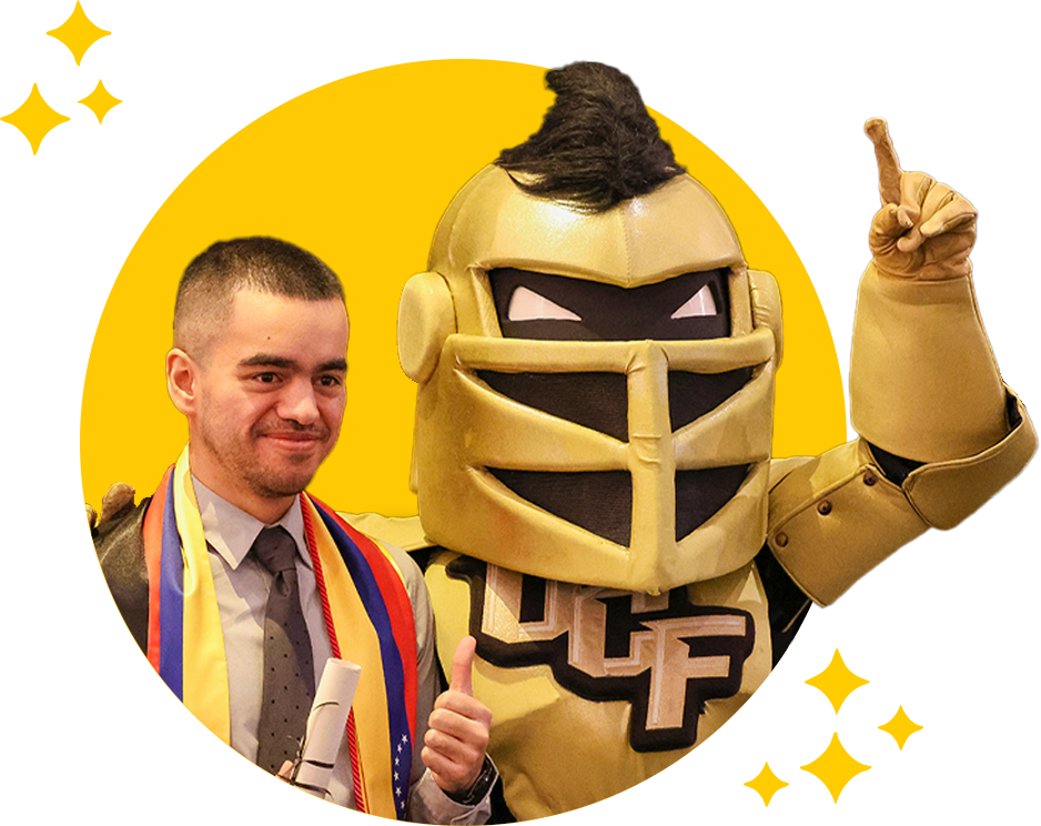 Knightro and Student Knightri and graduating student posing for image