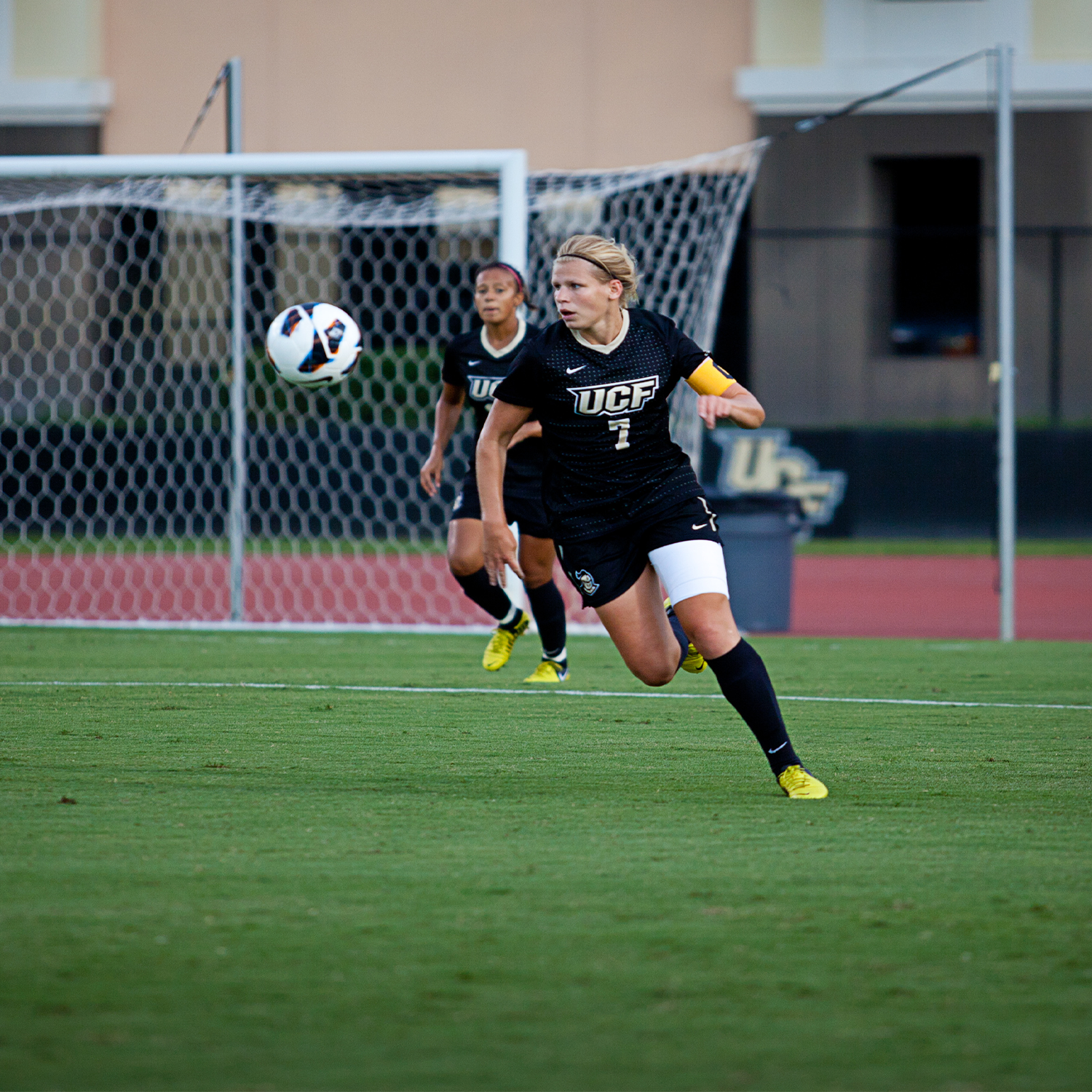 Woman Playing soccer on field