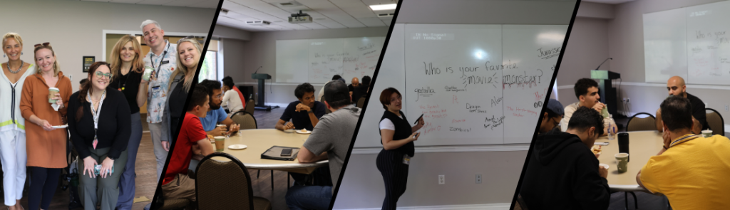 A group of people gathered in a meeting room, some standing and others seated at round tables. A whiteboard in the background displays handwritten responses to the question “Who is your favorite movie monster?” with names like Godzilla and Zombies. Coffee cups and notebooks are visible on the tables.